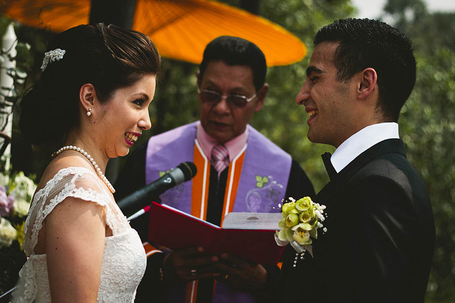 Chiang Mai wedding photographer - Happy couple laughing during wedding ceremony