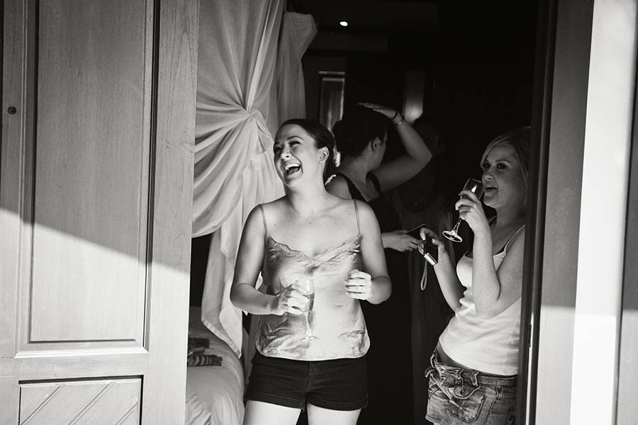 Destination Wedding Photographer - Bride and bridesmaids laughing