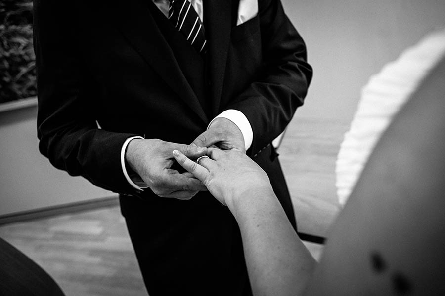 Embassy Wedding - Groom giving bride wedding ring